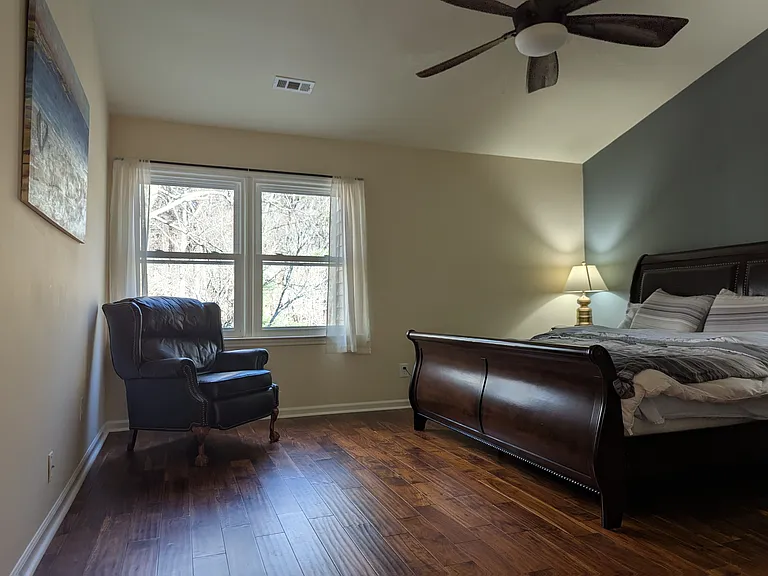 Master bedroom and windows overlooking Hemlock Bluffs Nature Preserve