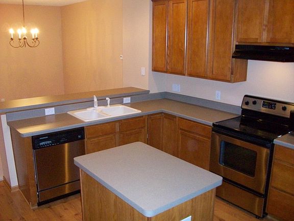 Center island with maple floors & cabinets