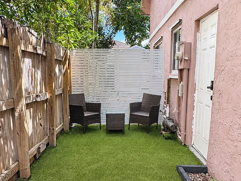 Your own private outdoor space ___ This cozy patio is exclusively for the efficiency and leads directly to its private entrance _ a perfect little spot to relax, enjoy your morning coffee, or unwind outdoors.