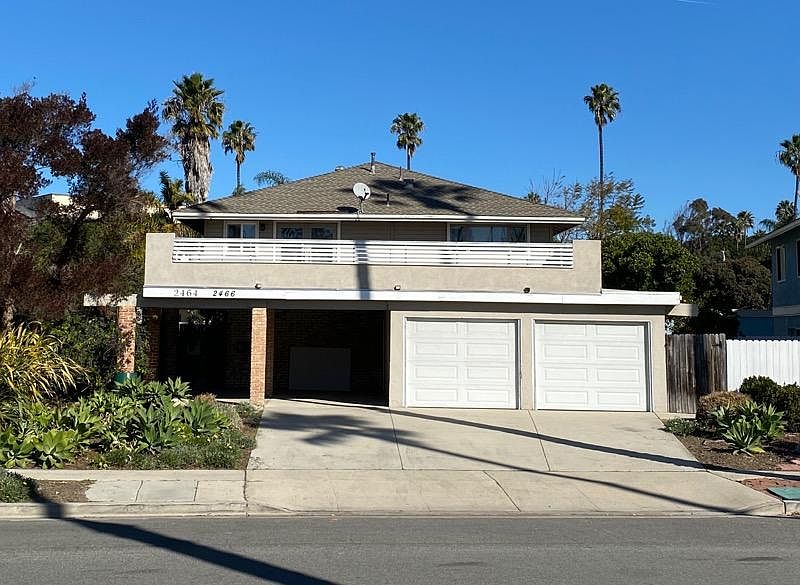 One private garage (left) and plenty of parking.