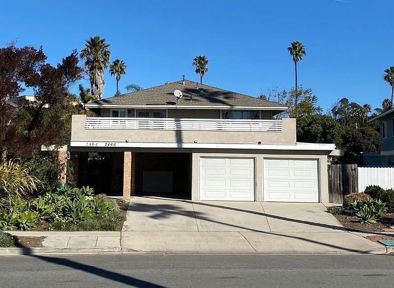 One private garage (left) and plenty parking.