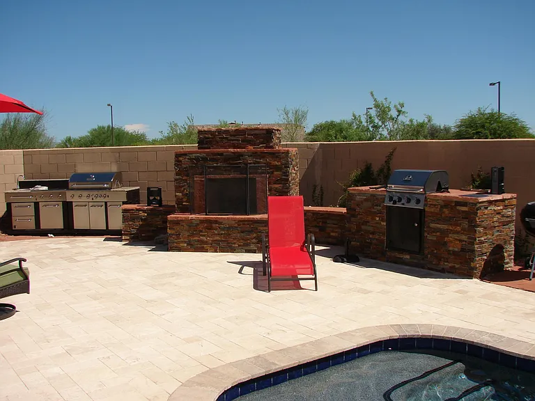 Backyard with fireplace & built-in grill
(outdoor kitchen or yard furniture not included)