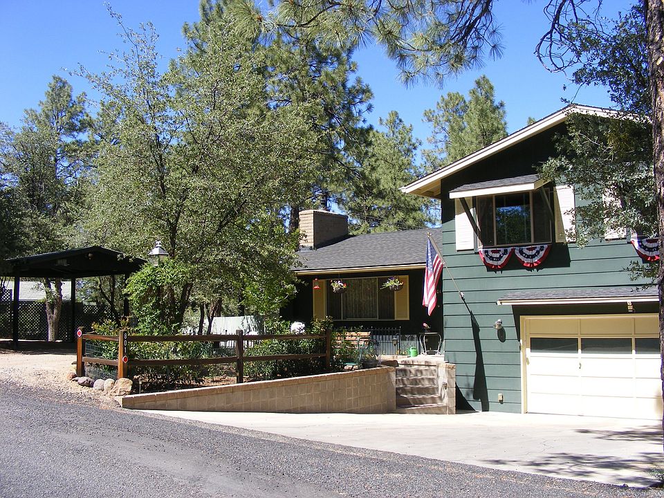 Front w/ 2 Rose Gardens & Carport U Driveway