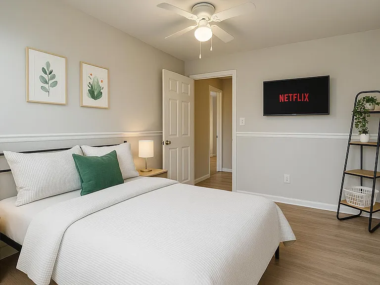 Bright, cozy room with leafy views, comfy bedding, and a peaceful stay-ready vibe.