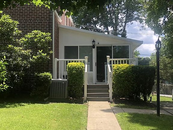 Side entrance, through sunroom.