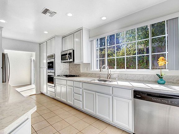 Kitchen with stainless steel appliances.