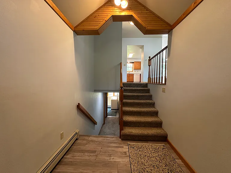 Front entry area, stairs to main level and basement