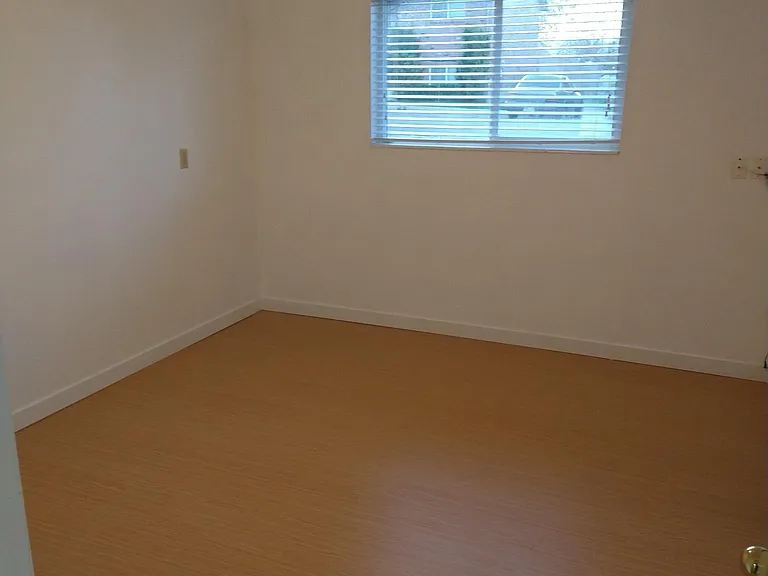Master Bedroom, huge closet, blinds, plenty of outlets, and new vinyl flooring for easy cleaning.