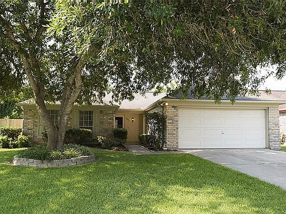 The front of this home has been nicely landscaped and has a large mature tree which boasts curb appe