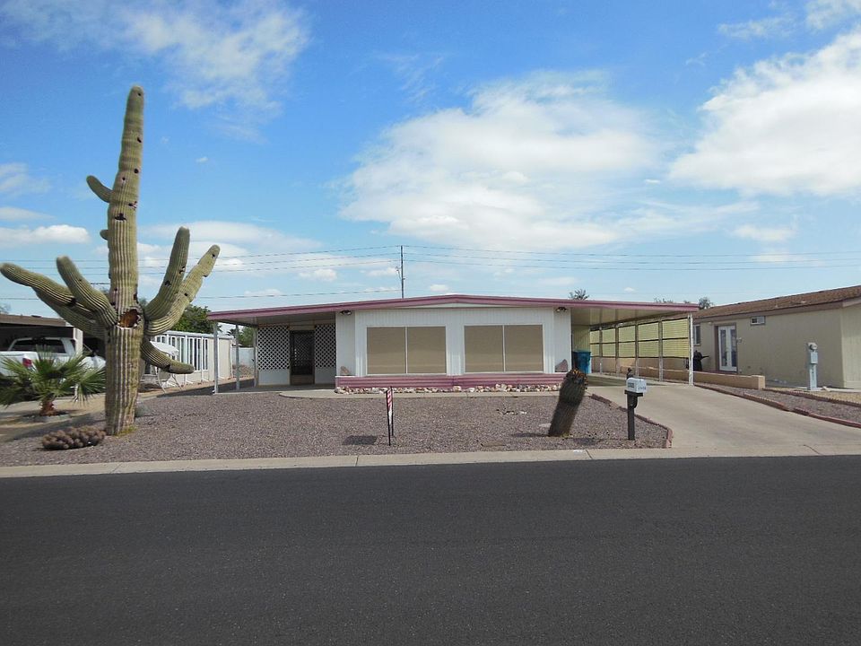 Front of home with patio and carport