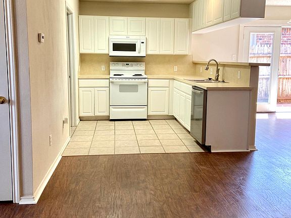 Kitchen comes equipped with built in microwave, stove and oven, dishwasher, disposal and new goose neck faucet! The duplex does 
NOT come with a refrigerator, but there is electrical outlet in place.