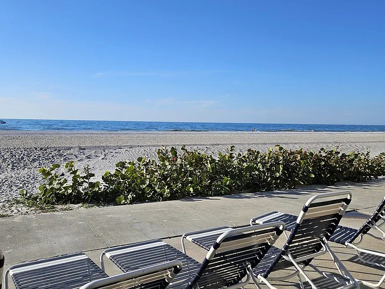 Beautiful new wide sandy beach with lounge chairs Gulfside