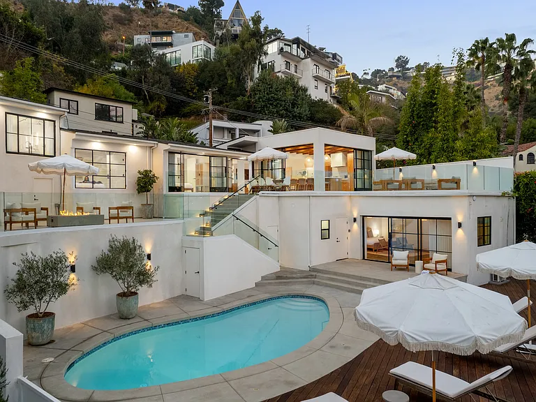 Where multi-level terraces, a glowing fire pit, and a sparkling pool redefine hillside living.