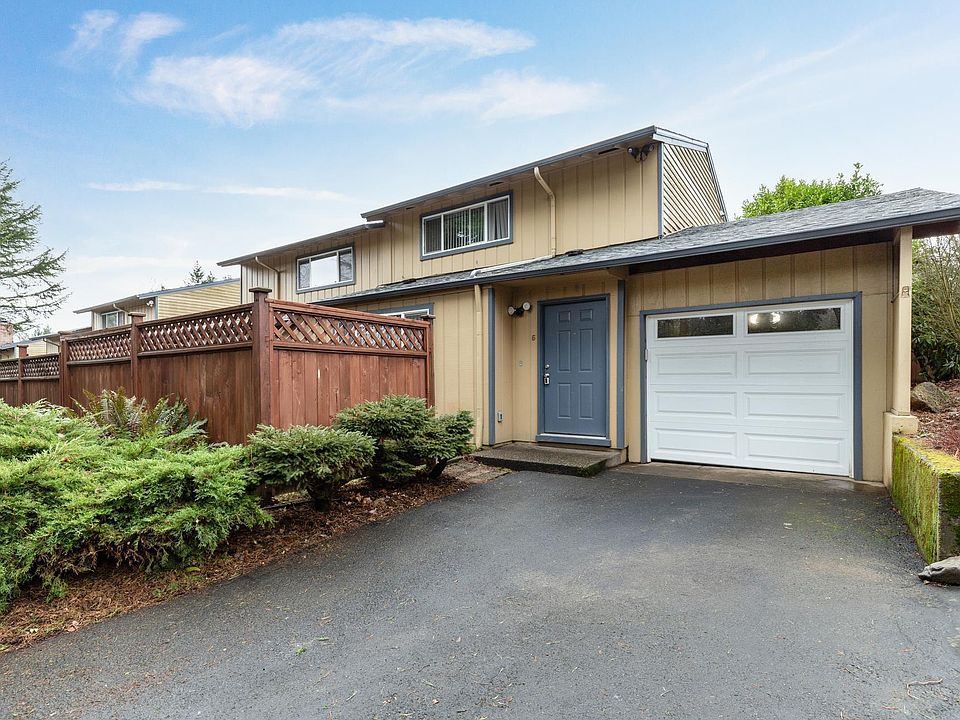Exterior w/ Garage, Driveway, Enclosed Patio