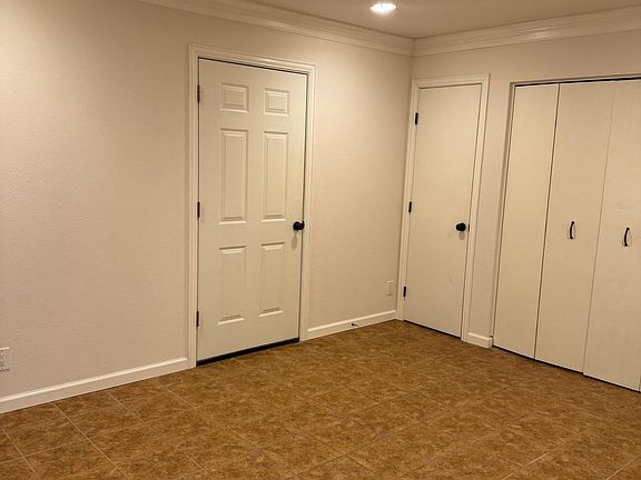 Bonus room (view b)
-door into garage
-small storage closet
-laundry closet