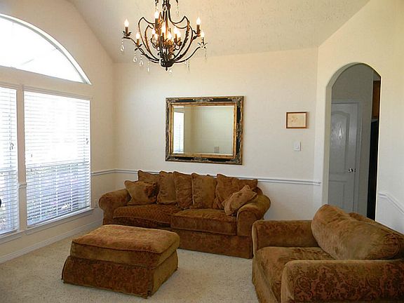 Formal dining room is being used as a family room.
