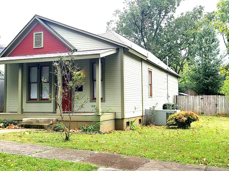 Enjoy relaxing on the front porch of this charming 1901 bungalow located one block from downtown Decatur. There's a driveway for your parking needs.