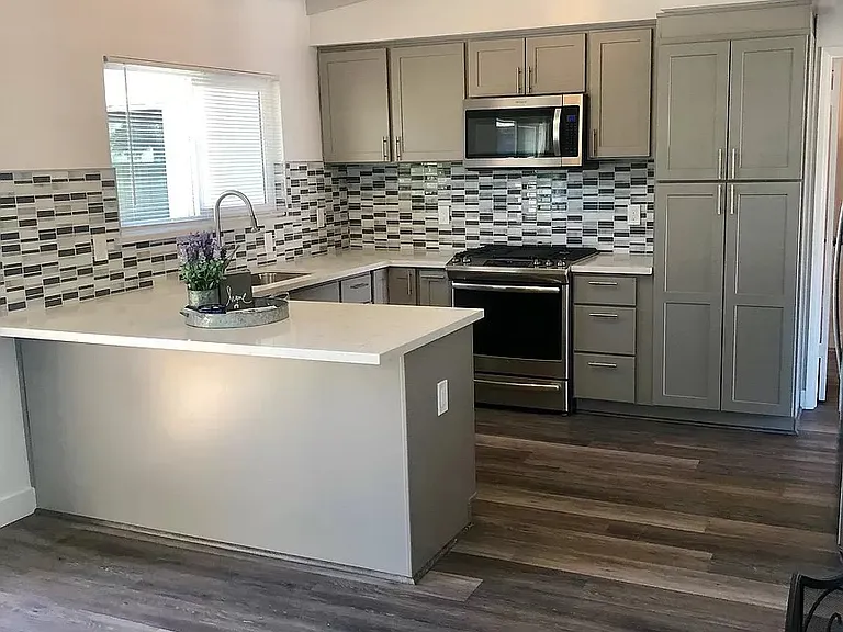 Kitchen, with stove, fridge, disposal, microwave and dishwasher.