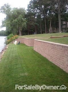 Water Frontage and Brick Wall