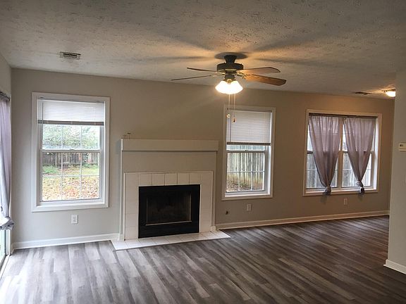 Also living room - sliding glass door on left. Dining area is far right and would lead to kitchen.