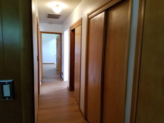 hallway with closets