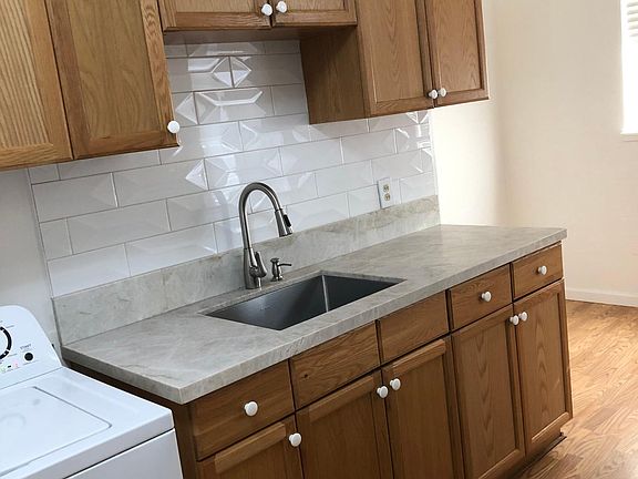 kitchen with new sink and quartz counter