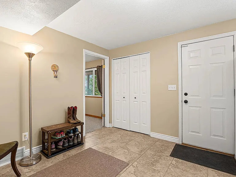 Looking at master bedroom and unit entrance