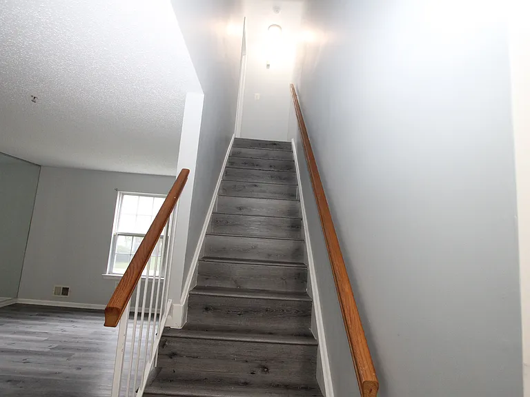 Fully hardwood and renovated stairs. Painted walls and ceiling.