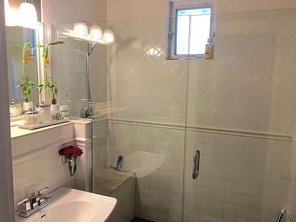 Tiled shower, high end shower head, pedestal sink, good water pressure.