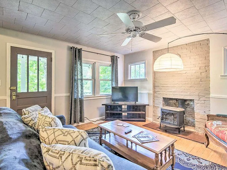 Since these pictures were taken, we've replaced the fireplace, replaced the ceiling with drywall, and recently painted.