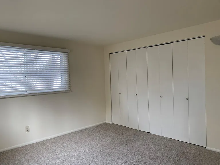 Double closets with shoe storage in Large Master