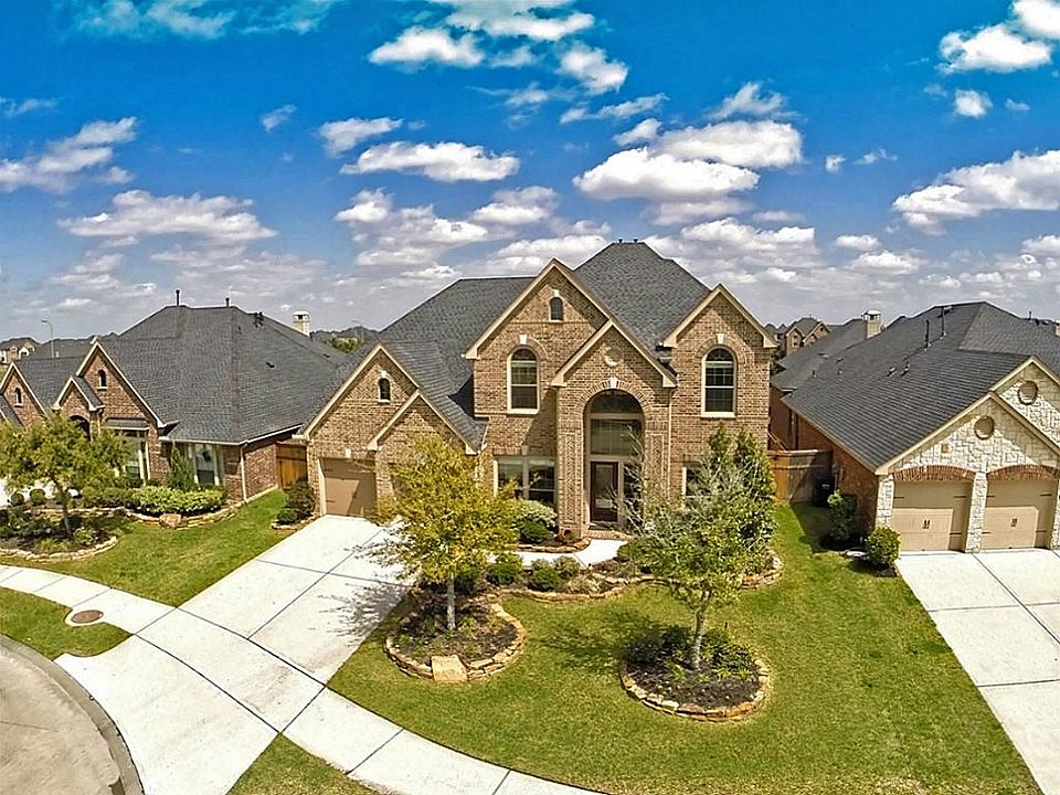 Exceptional design captures the eye of this home with gable roofs that draw the eye upward while a t