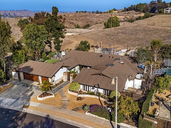 The 4200 sf home sits prominently on the property, with endless views out the back and direct access to 60 miles of local horse trails