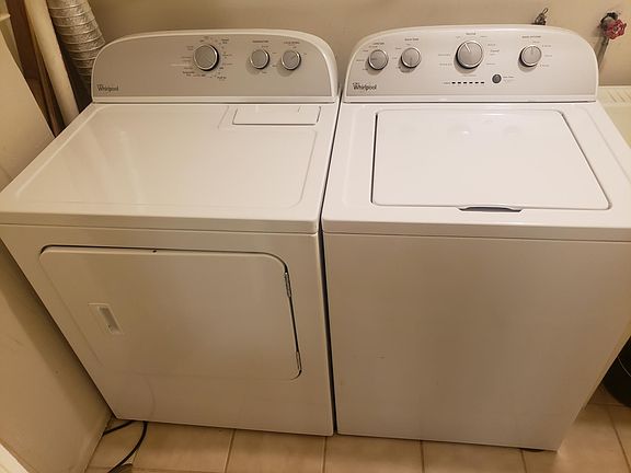 Laundry room with washing machine and drying