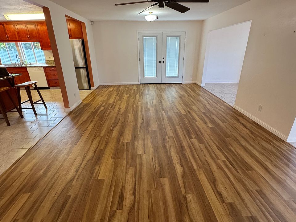 View of the great living room area. With an door leading to the lounging area/sidewalk to bonus room