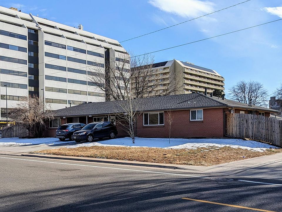 This spacious triplex includes the private yard and fenced area pictured here (right side of house)