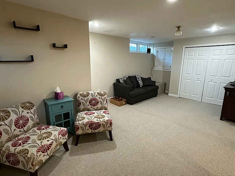 Spacious finished basement offers several spaces for recreational use or home office.
