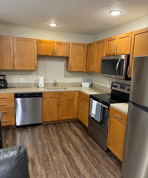 kitchen has dishwasher, stove, refrigerator and New microwave