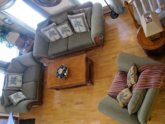 View of living room from top of stair case. 