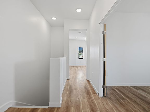 Entry from patio and looking towards the living room. Guest bedroom on the right.