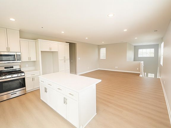 Kitchen with view of Great Room and Stairway.