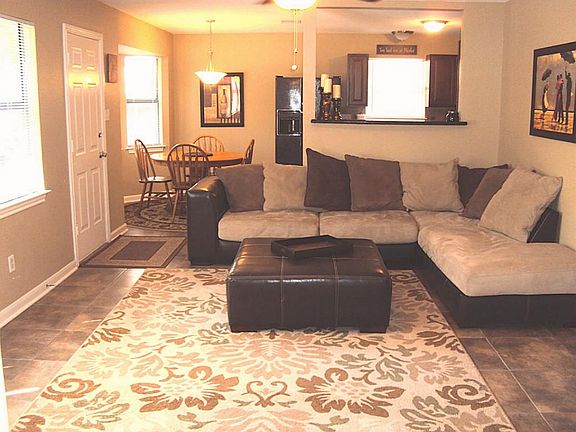 Large open living area. Picture does not do it justice. Custom tile flooring is beautiful.