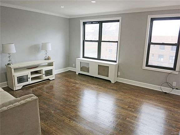 Large living room with large windows bringing the outside in