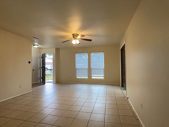 Front entry in background. Looking from dining area