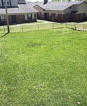 LARGE FENCED BACK YARD SHARED BY BOTH UNITS...