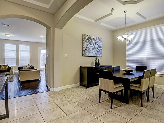 The formal dining room is flooded with light from the large picturesque window and makes for a great entertaining space.