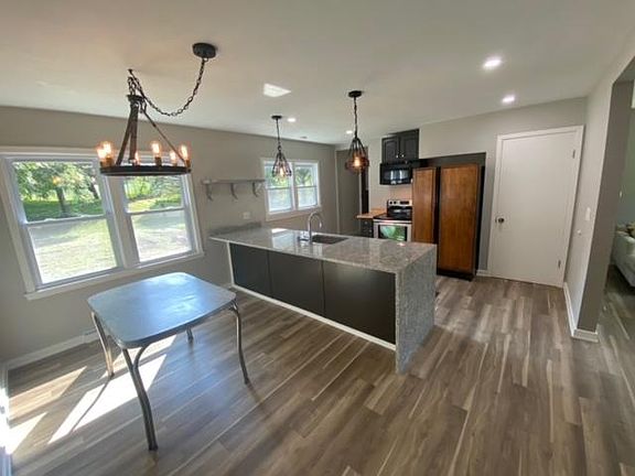 View of kitchen and dining area.
