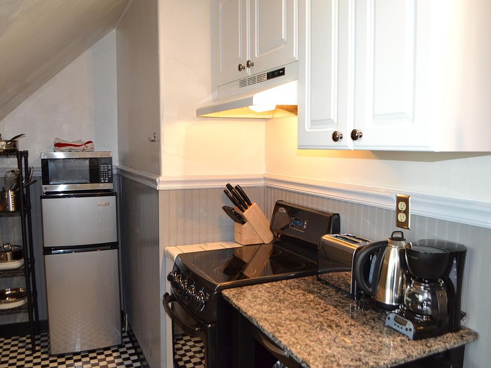Kitchen. A new fridge that is bigger and a new oven (white) has been added to upgrade the apartment.