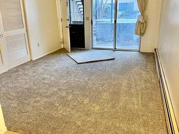 Living room and exit to patio.