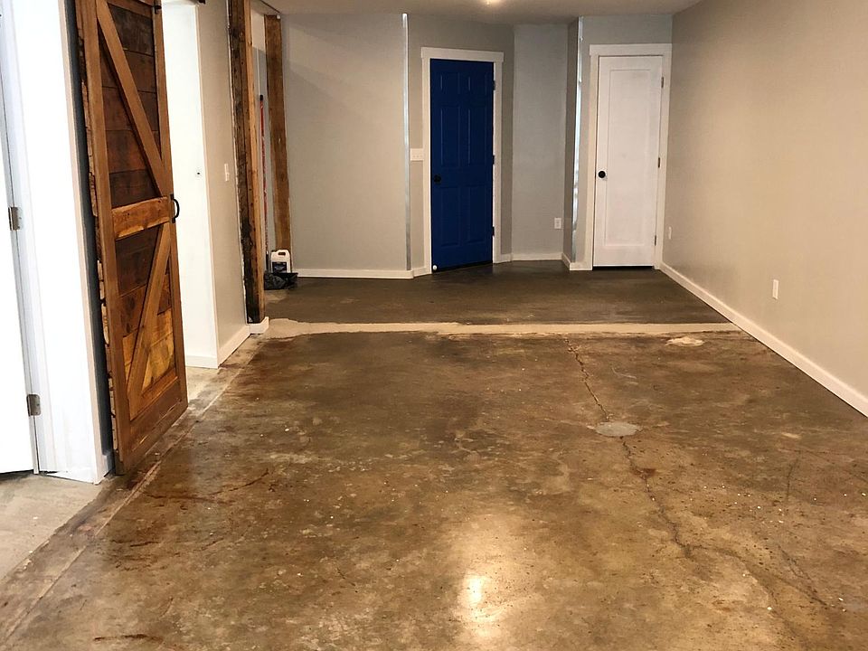 Large, Open Living Space with sealed concrete floors for easy maintenance.